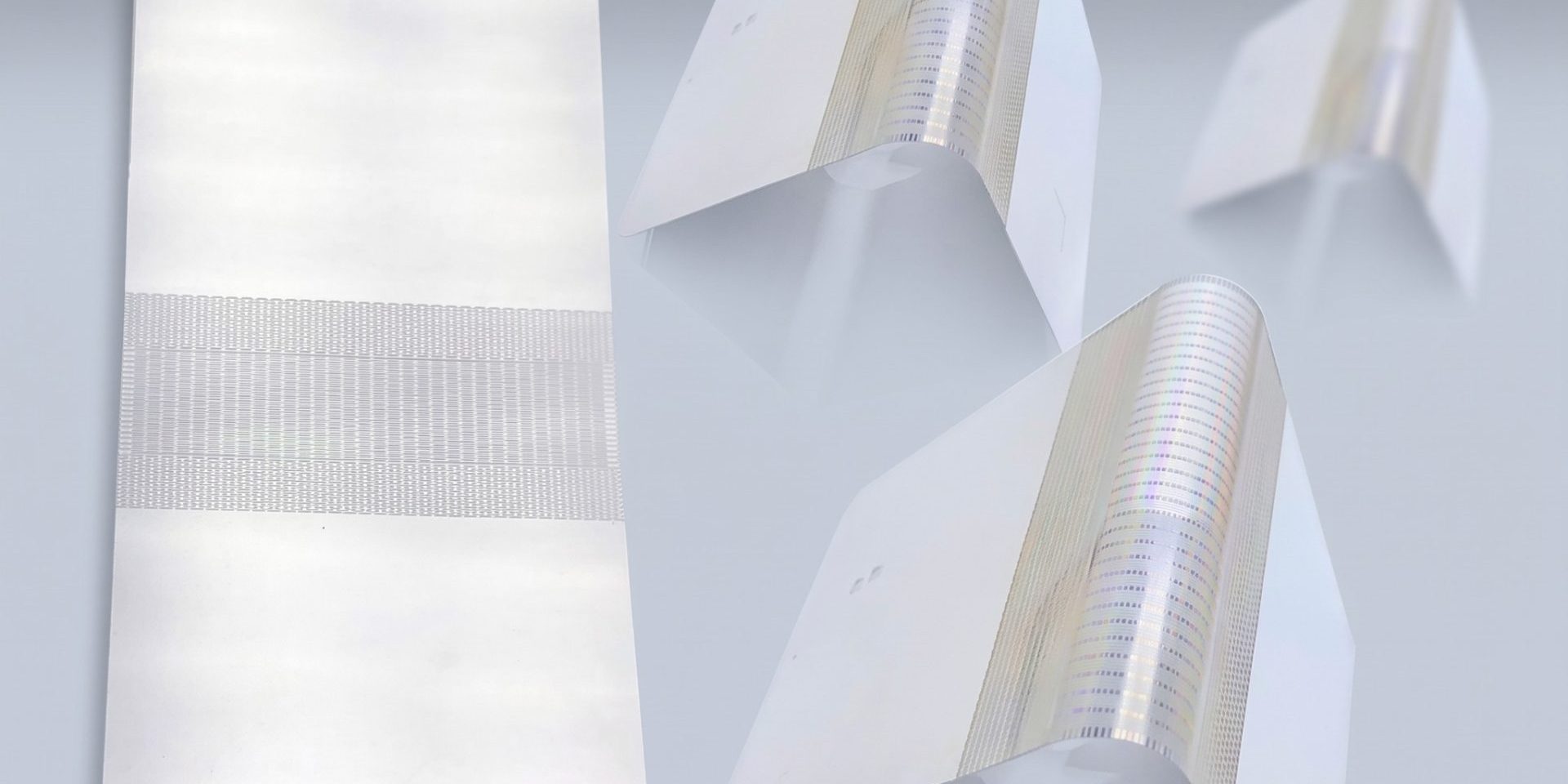 Flat and formed thin metal support plates showing foldable-smartphone manufacturing stages