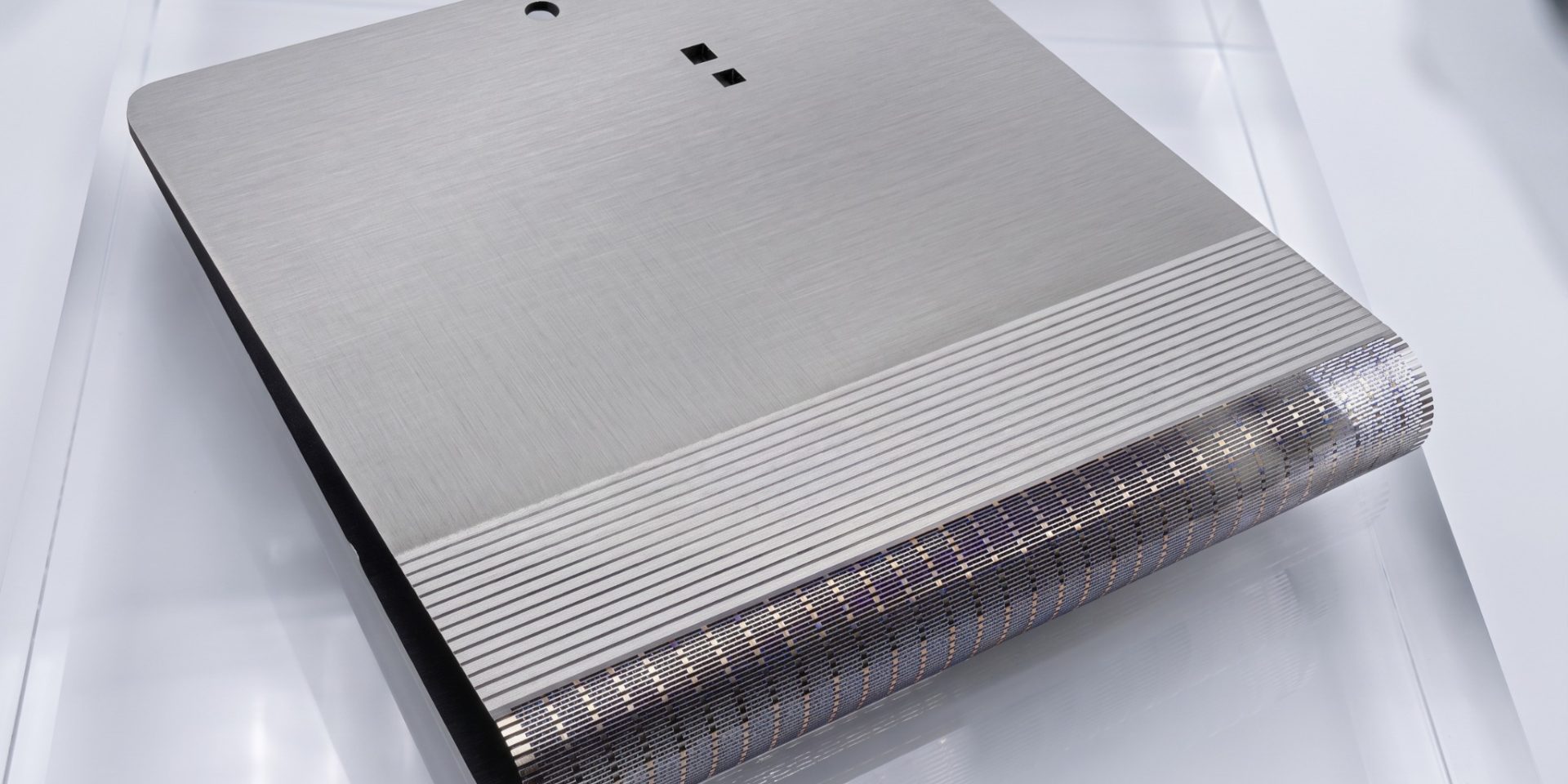 Thin titanium support plate with dense etched folding-zone pattern for foldable electronics DFM