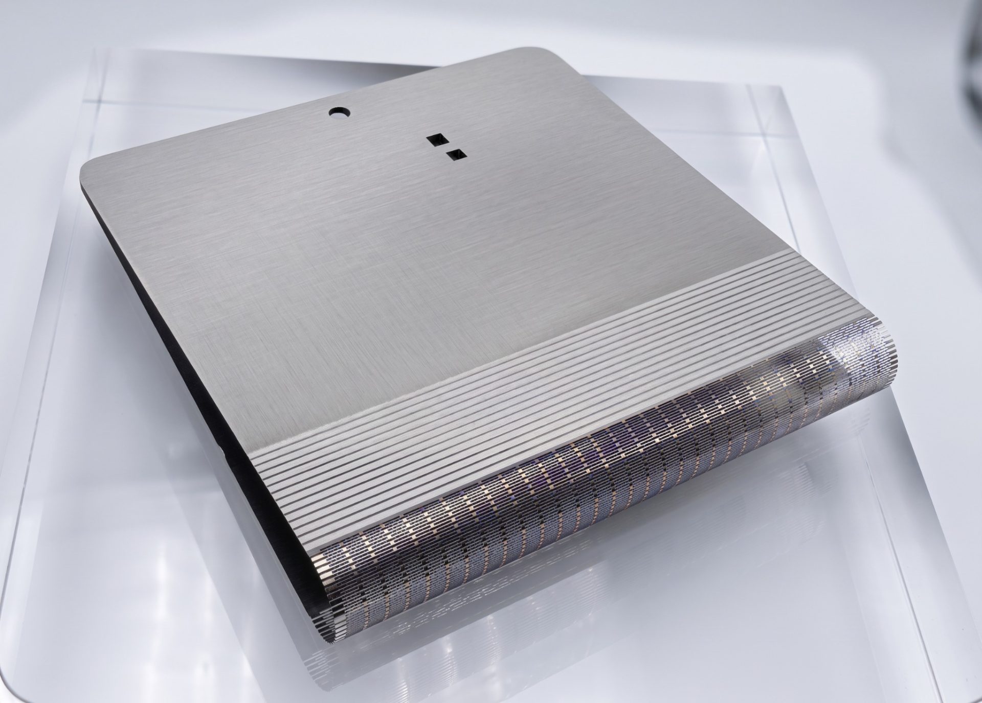 Thin titanium support plate with dense etched folding-zone pattern for foldable electronics DFM